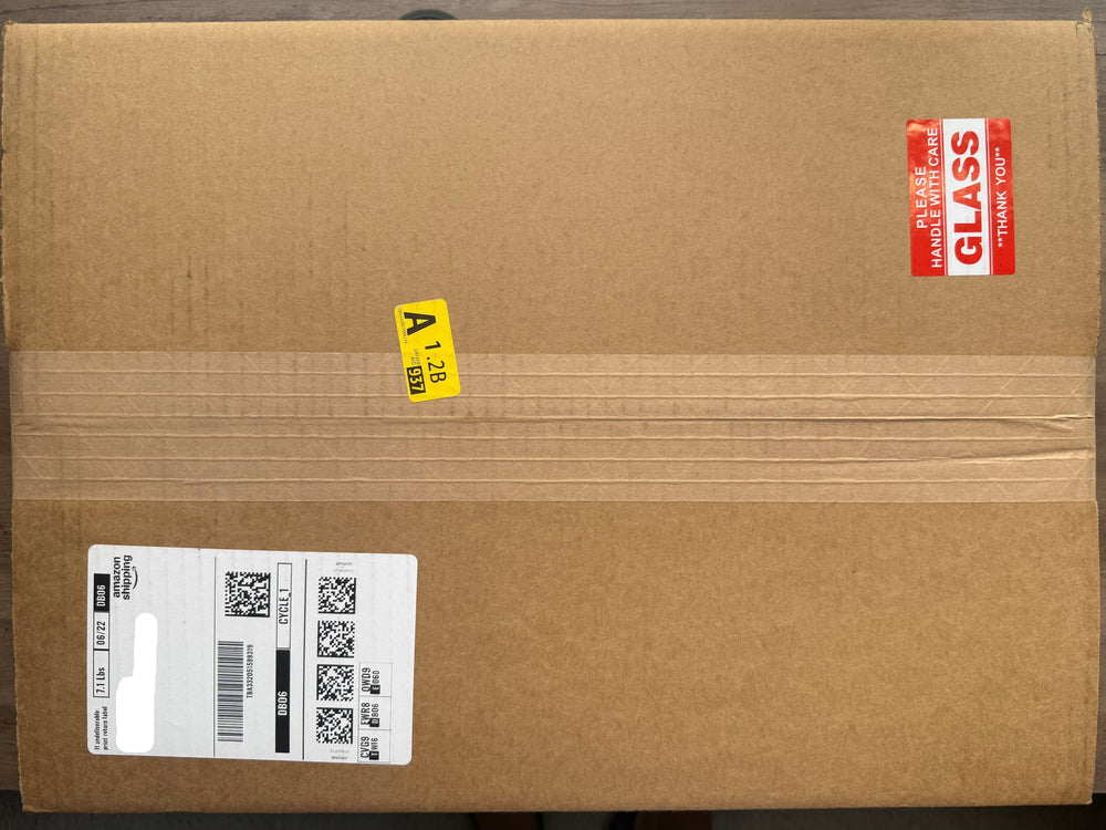 Cardboard box with shipping labels

11x17 framed drawing reprints shipping box.