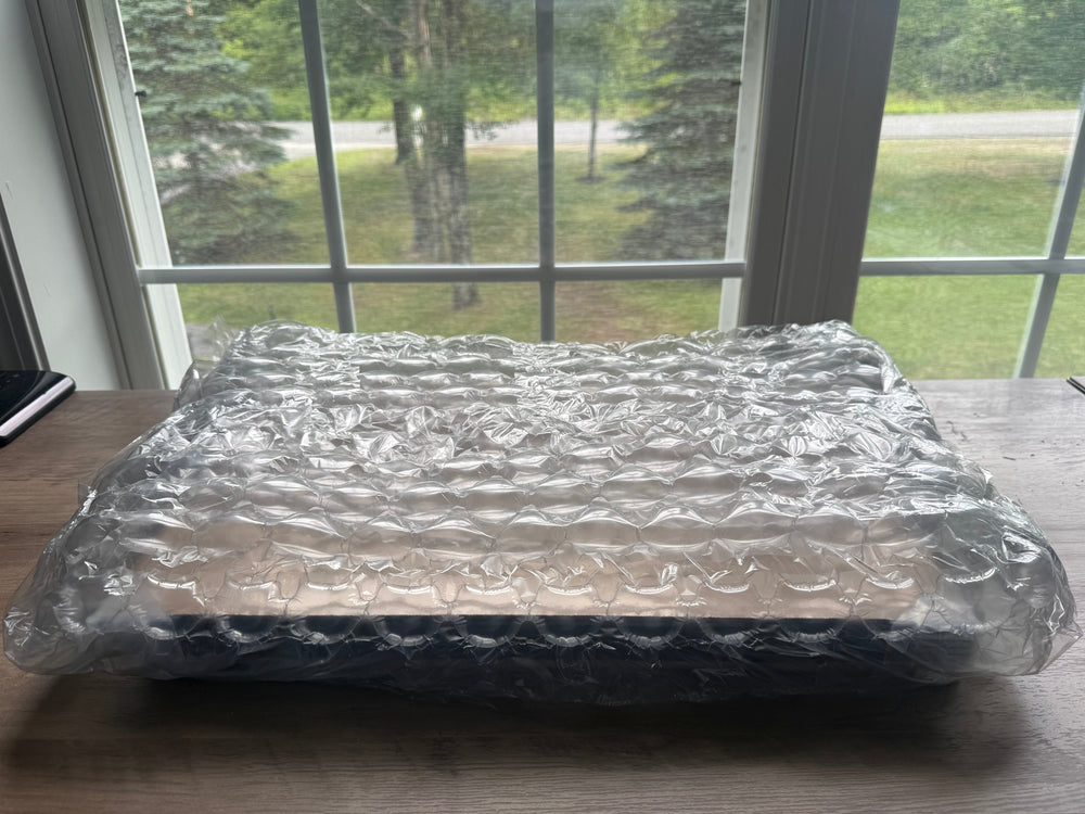 Package wrapped in bubble wrap.

11x17 framing drawing reprints packaged in bubble-wrap.